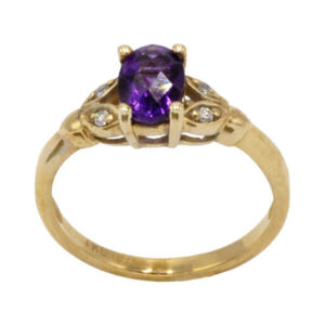Oval cut amethyst with diamonds in a vintage style yellow gold setting