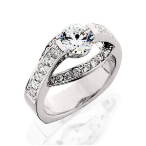 unique Aurum engagement ring set with a half bezel style center head and natural brilliant cut diamond melee 