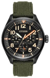 Black stainless steel with black dial and luminous hands and markers with a nylon strap and buckle closer.