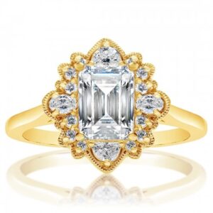 Natural diamond engagement ring set with brilliant cut, oval cut and shield cut diamond melee and an emerald cut center diamond 